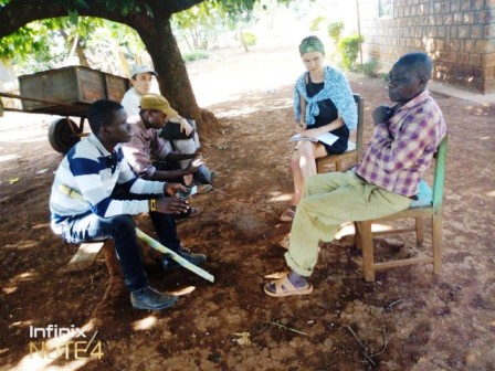 Students interviewing a farmer in Kibugu on micro-finance